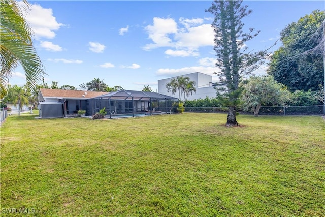 view of yard with a lanai