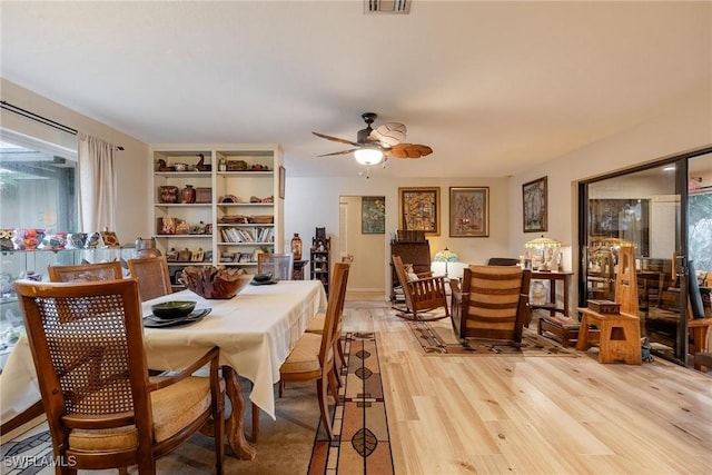 dining area featuring ceiling fan and light hardwood / wood-style floors