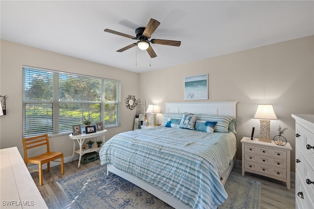 bedroom with hardwood / wood-style flooring and ceiling fan