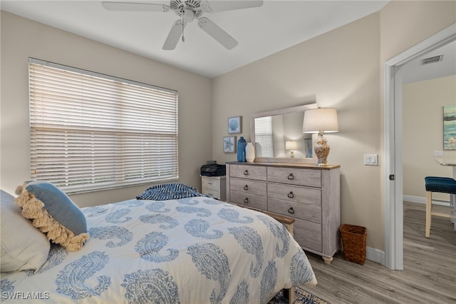 bedroom featuring light hardwood / wood-style flooring and ceiling fan