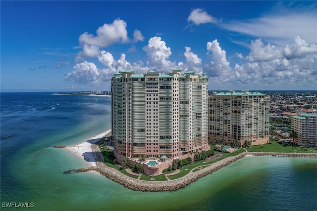 bird's eye view featuring a water view and a beach view