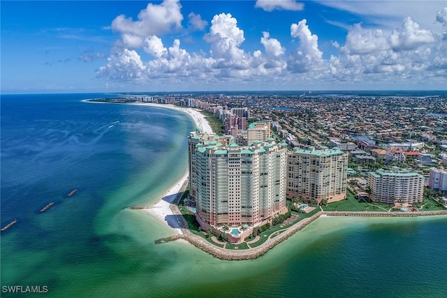 birds eye view of property featuring a view of the beach and a water view