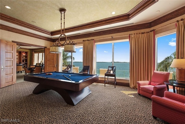 playroom with a water view, pool table, carpet flooring, and a raised ceiling