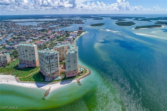 bird's eye view with a water view and a view of the beach