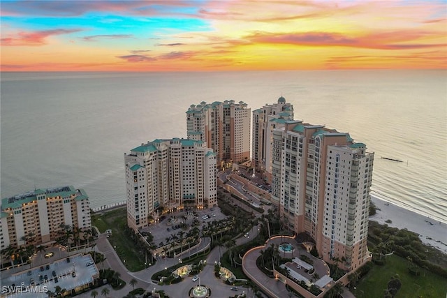 aerial view at dusk with a water view