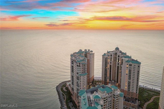 aerial view at dusk with a water view