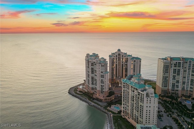 aerial view at dusk with a water view