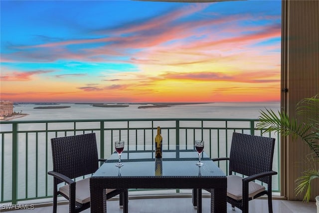 balcony at dusk with a water view