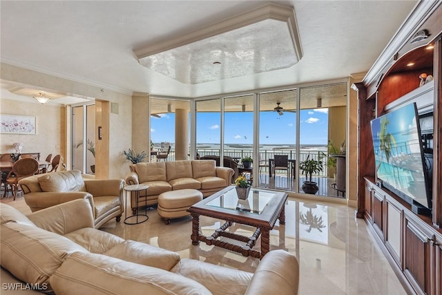 living room with a healthy amount of sunlight, ornamental molding, and a wall of windows