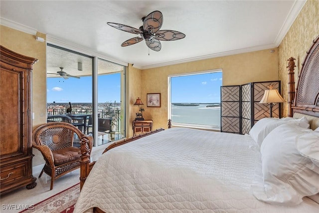 bedroom with multiple windows, ornamental molding, and a water view