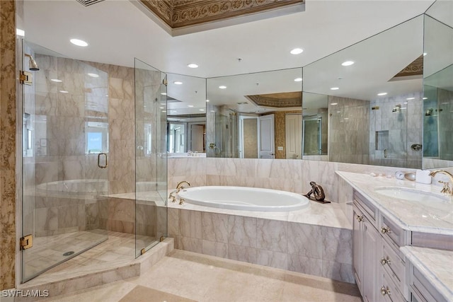 bathroom featuring vanity and shower with separate bathtub