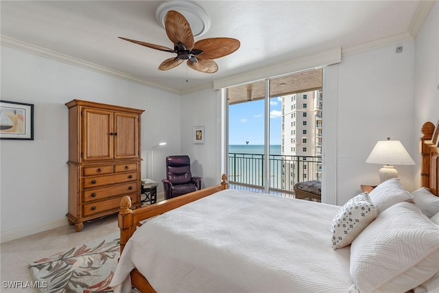 bedroom featuring ceiling fan, access to exterior, a water view, ornamental molding, and light carpet