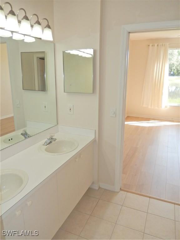 bathroom featuring tile patterned floors and vanity