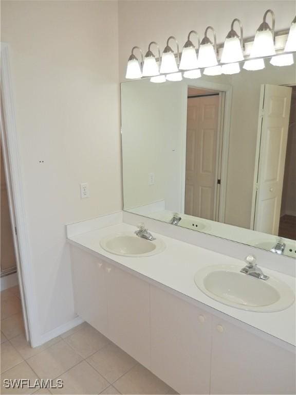 bathroom featuring vanity and tile patterned flooring