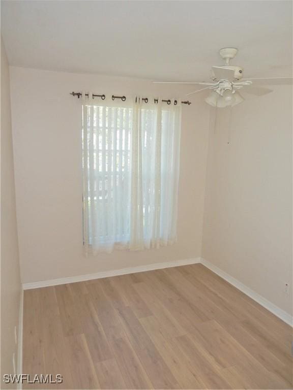 spare room featuring ceiling fan and light hardwood / wood-style flooring