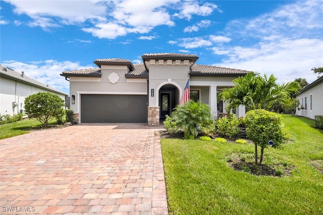 mediterranean / spanish-style home with a garage and a front lawn