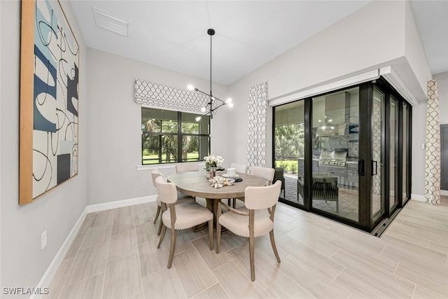 dining space with a notable chandelier and a wealth of natural light