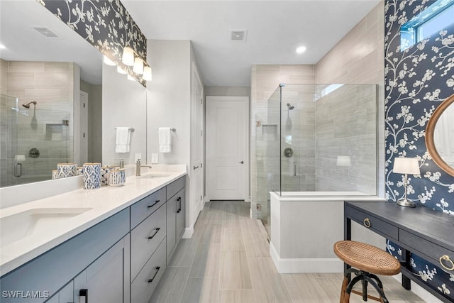 bathroom with vanity and an enclosed shower