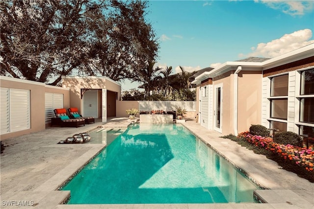 view of pool with a patio area and an outdoor structure