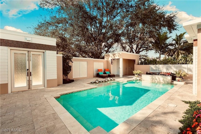 view of swimming pool featuring a patio area