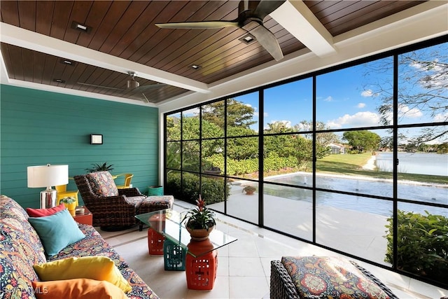 sunroom with wooden ceiling, a water view, ceiling fan, and beam ceiling