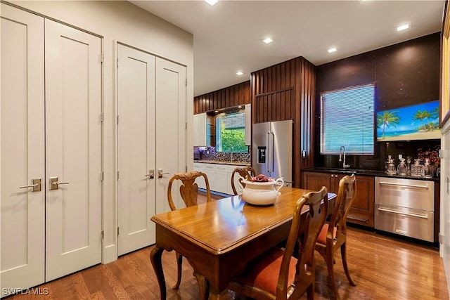 dining room featuring light hardwood / wood-style flooring and sink