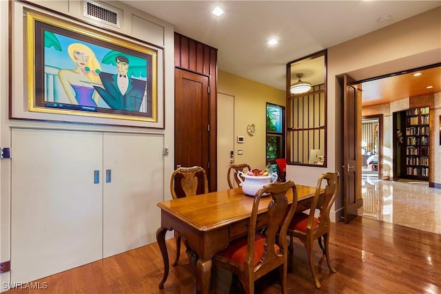 dining area with hardwood / wood-style flooring