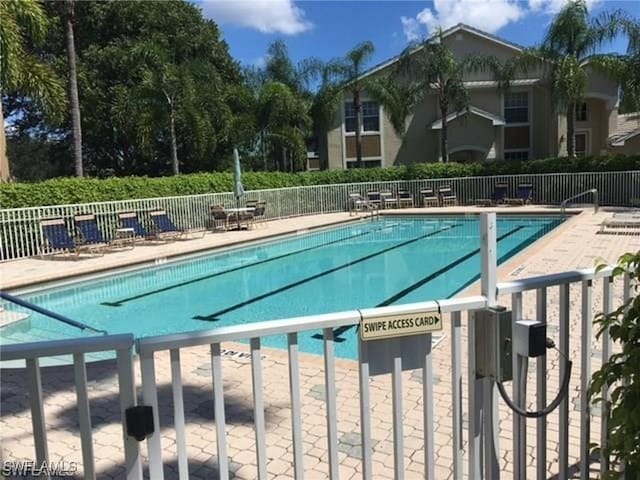 view of pool featuring a patio area