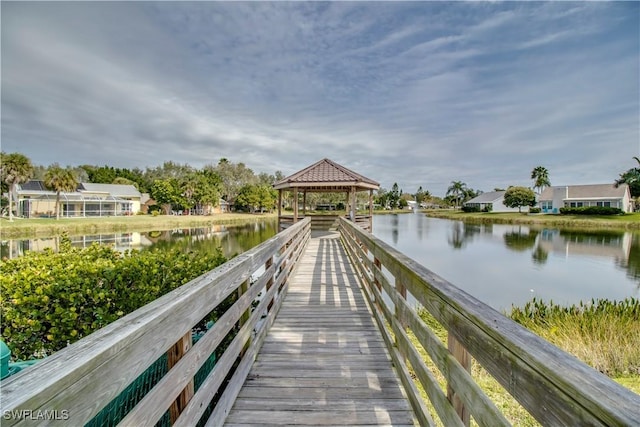 dock area featuring a gazebo and a water view