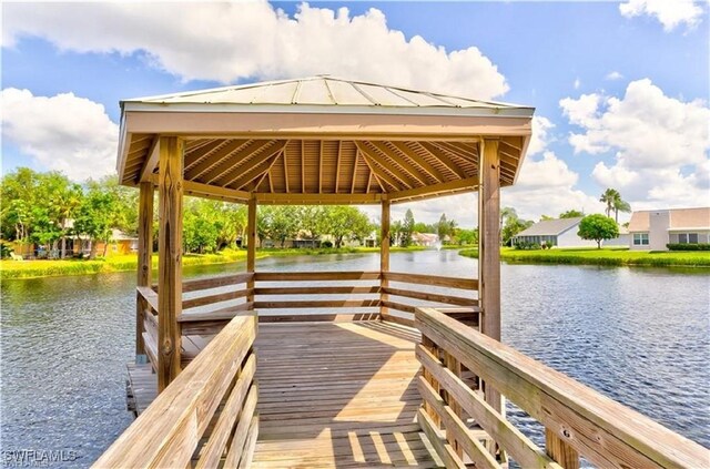 view of dock featuring a water view and a gazebo