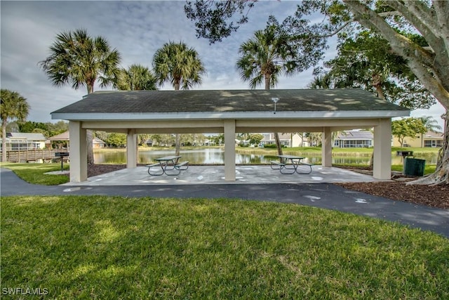 view of community featuring a gazebo, a lawn, and a water view