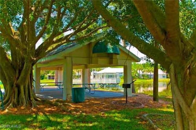 view of property's community featuring a water view and a gazebo