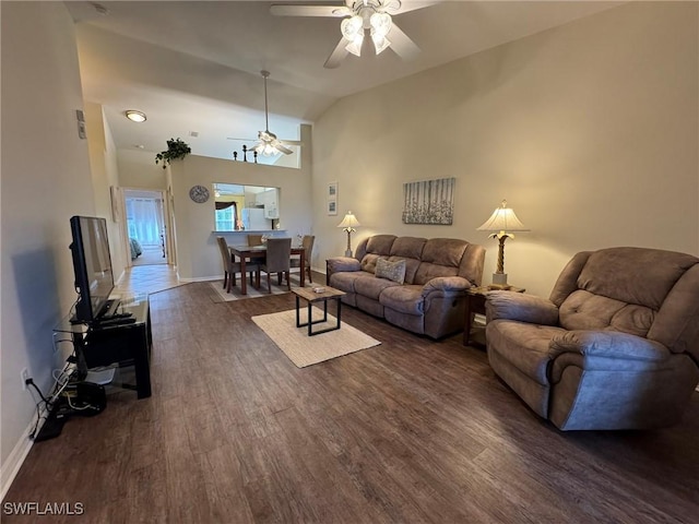 living room featuring ceiling fan, dark hardwood / wood-style floors, and lofted ceiling