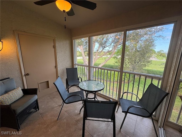 sunroom / solarium with vaulted ceiling and ceiling fan