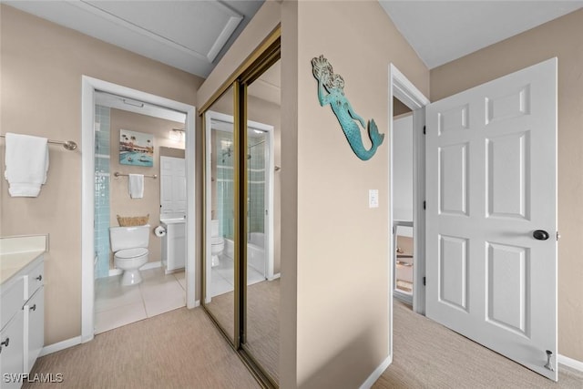 hallway featuring light tile patterned flooring
