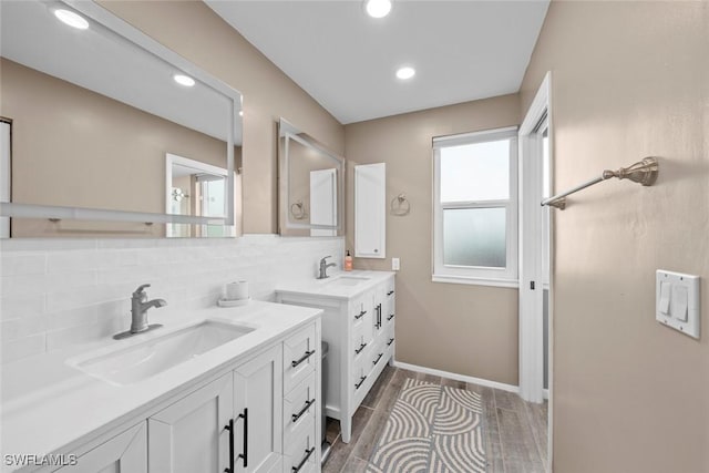 bathroom featuring tasteful backsplash and vanity