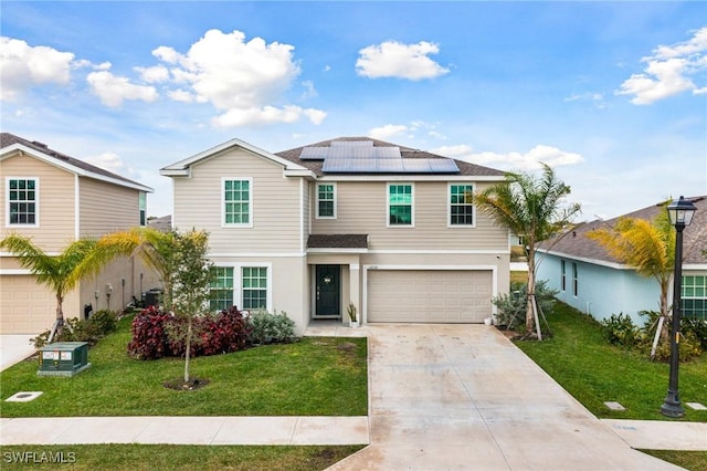 view of front of property with a garage, a front lawn, and solar panels