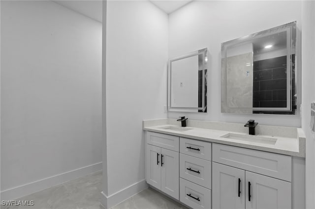 bathroom with walk in shower and vanity