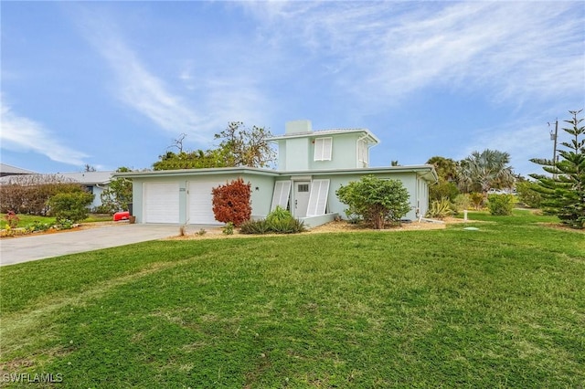 front facade with a garage and a front lawn