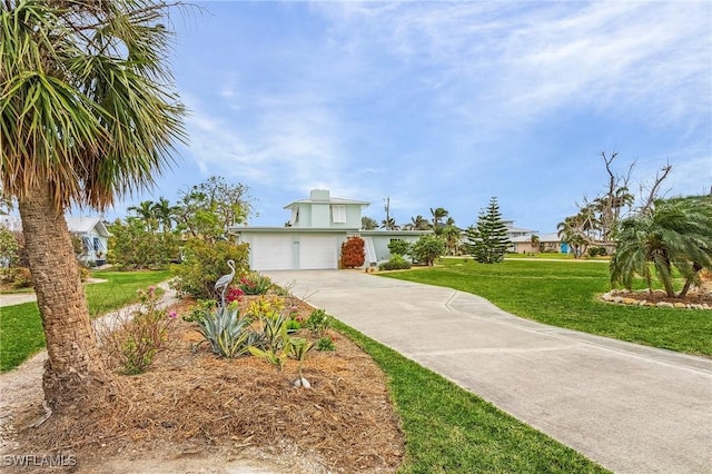 view of front of home with a garage and a front yard