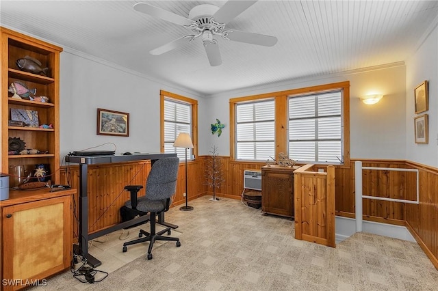 office space with built in shelves, crown molding, a wall mounted air conditioner, wooden walls, and ceiling fan