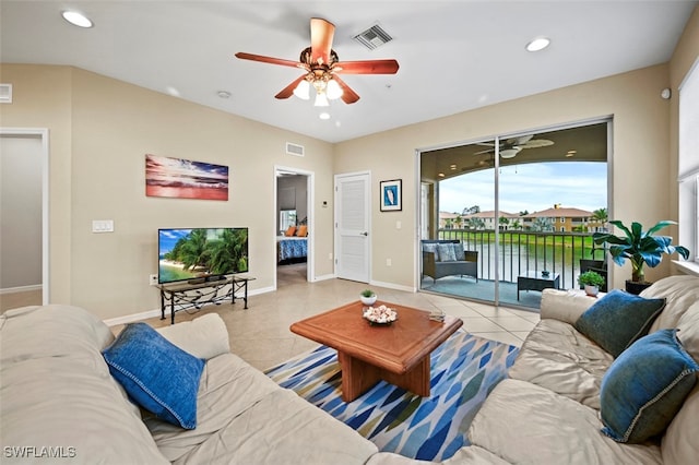 tiled living room with ceiling fan