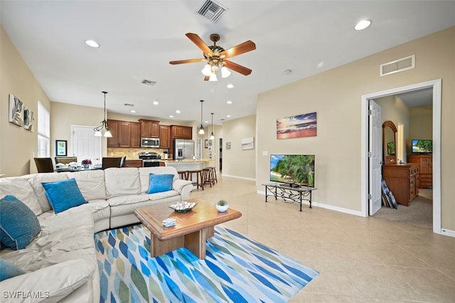 tiled living room with ceiling fan