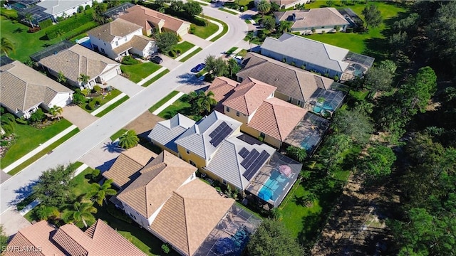 birds eye view of property with a residential view