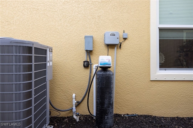 details with cooling unit and stucco siding