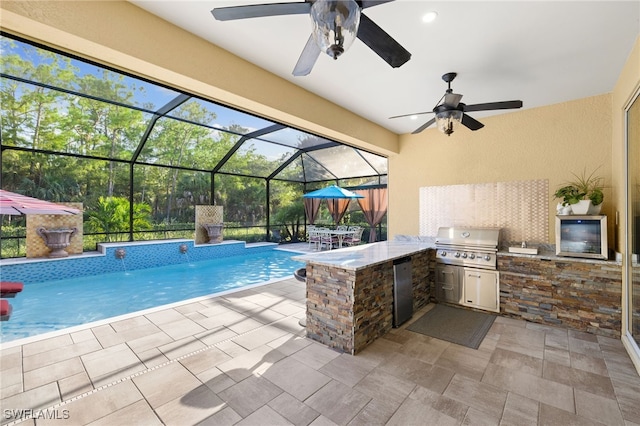 view of swimming pool with an outdoor kitchen, a grill, a patio area, and outdoor dry bar