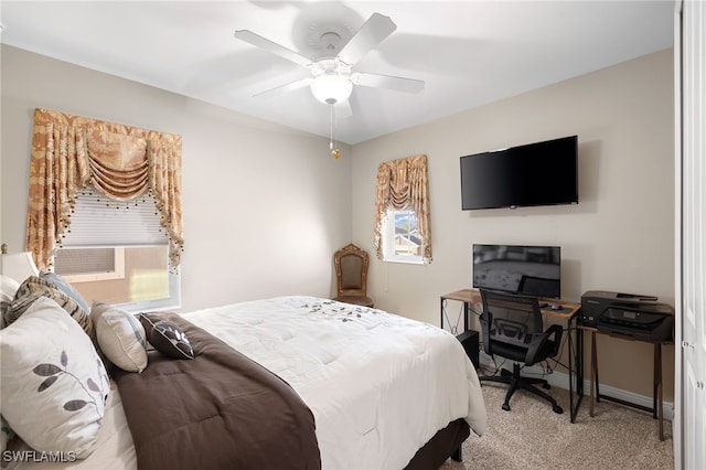 bedroom featuring light carpet, ceiling fan, cooling unit, and baseboards