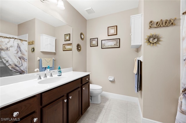 bathroom with baseboards, visible vents, toilet, tile patterned floors, and vanity