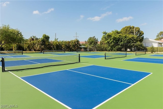 view of tennis court featuring basketball court