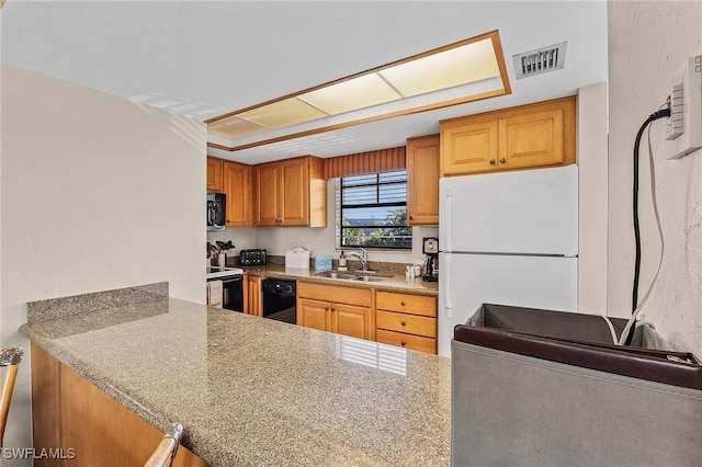 kitchen featuring sink and black appliances